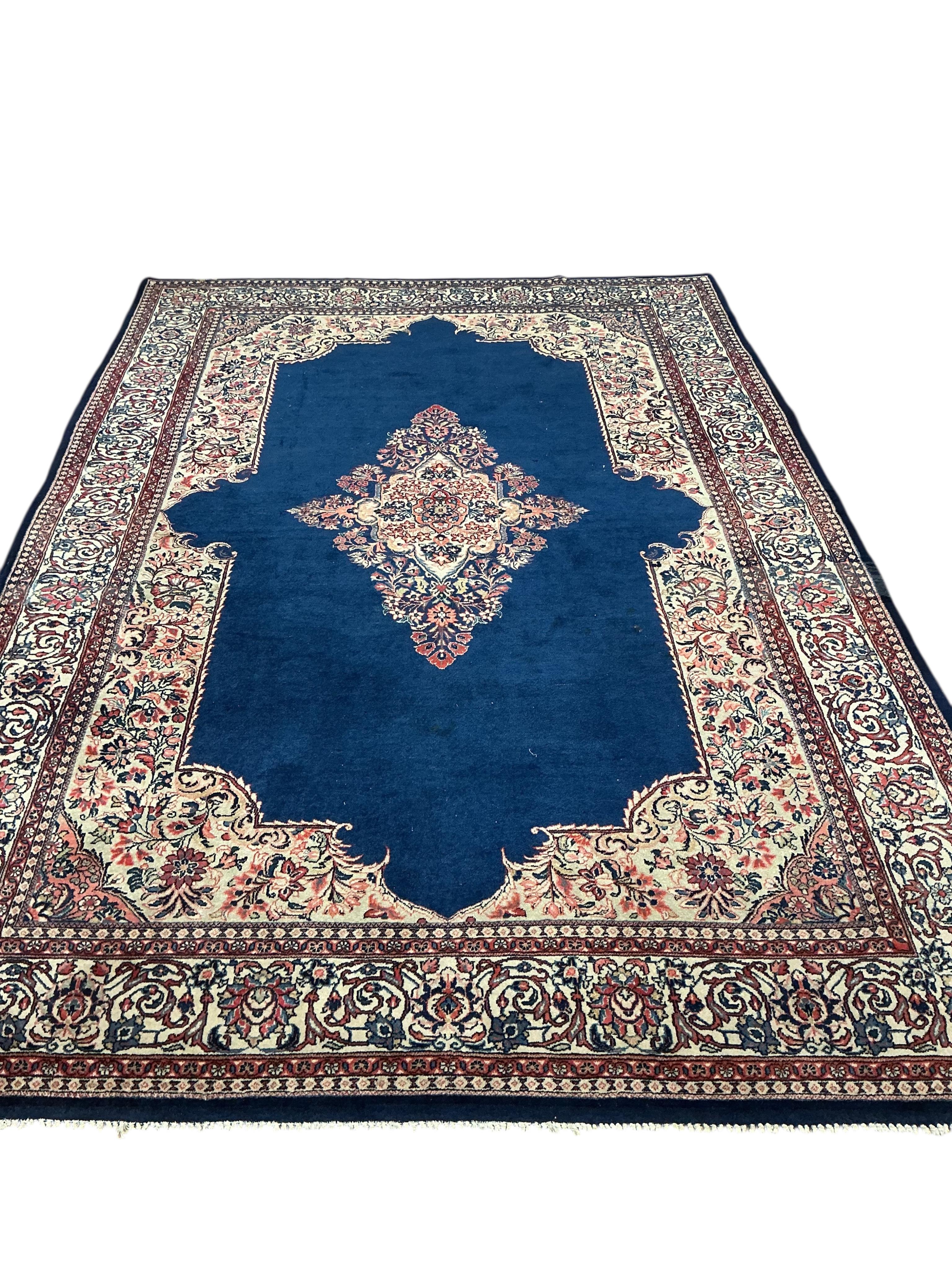 A Sarouk blue ground carpet, 320 x 210cm